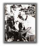 1950's -- Soichiro Honda on the assembly line.